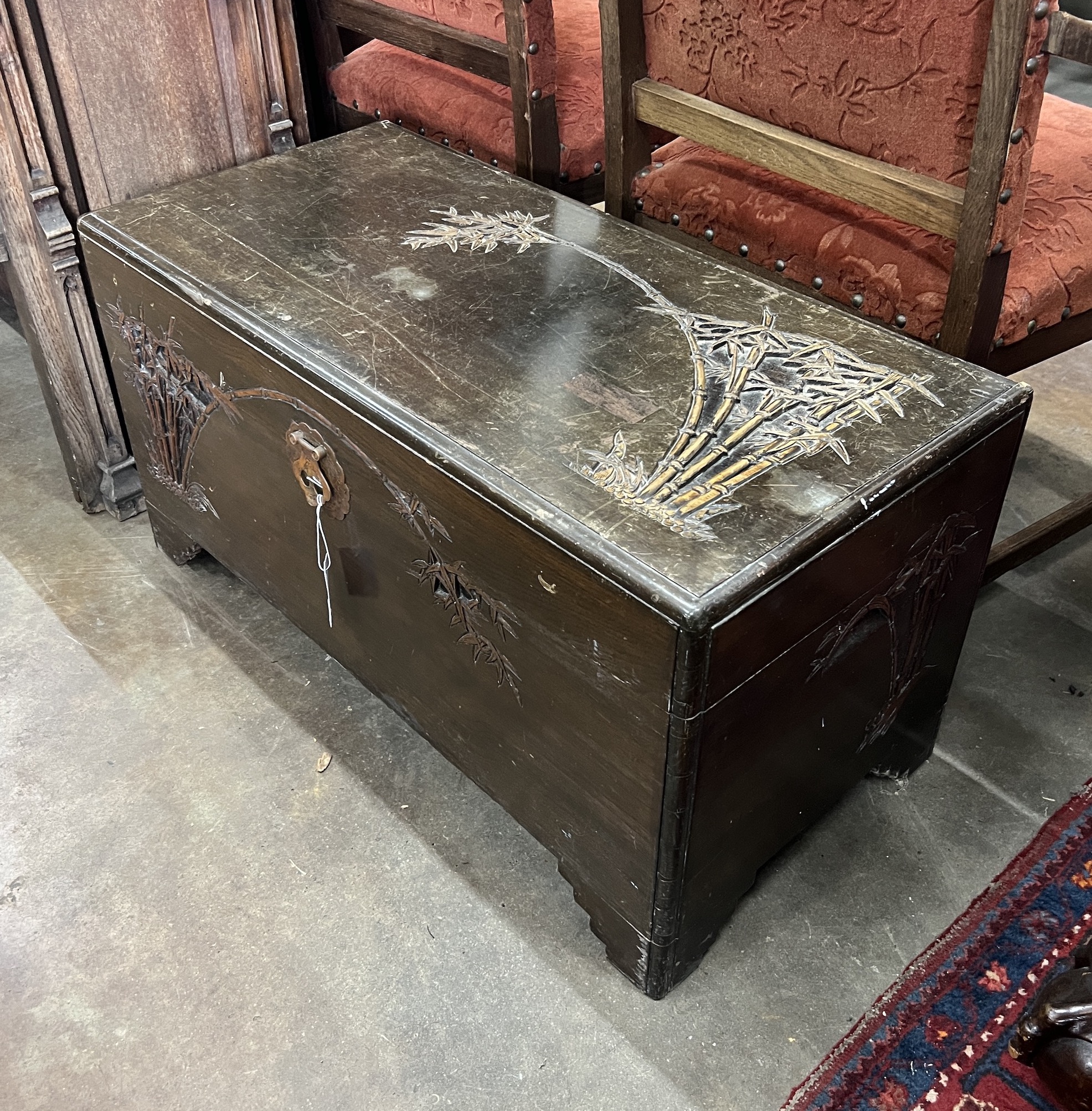 A Chinese carved camphorwood trunk, width 93cm, depth 44cm, height 48cm